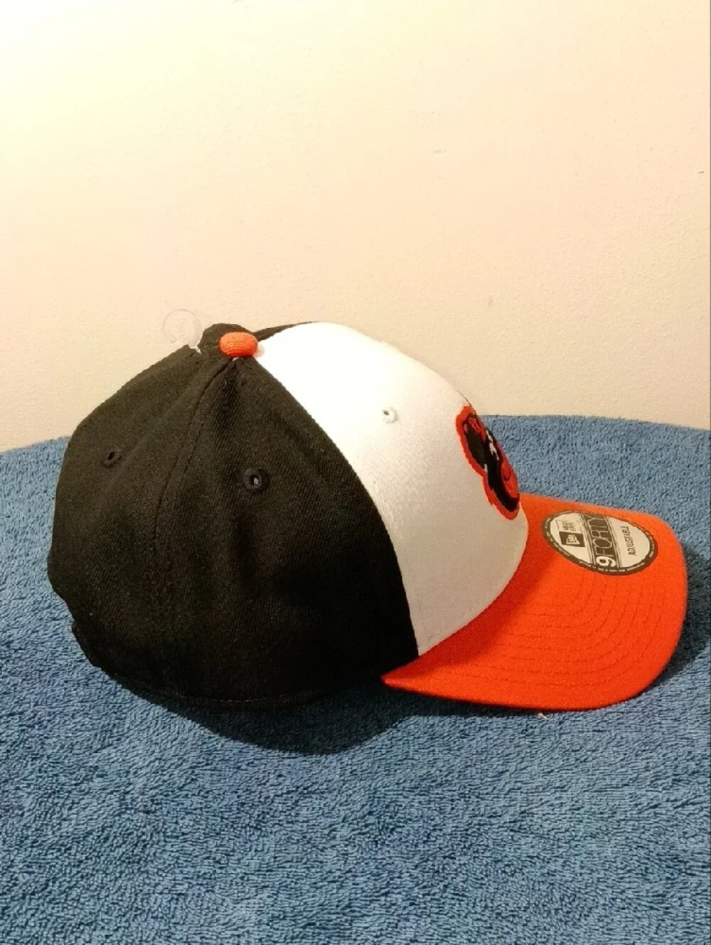 New Era Orioles 9FORTY Cap in White, Black, Orange